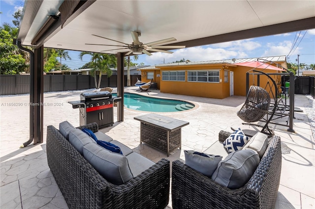 view of pool featuring a grill, ceiling fan, an outdoor hangout area, and a patio