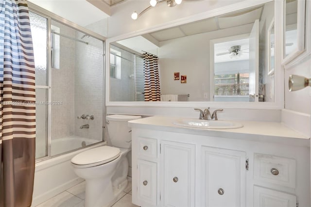 full bathroom featuring toilet, tile patterned floors, vanity, shower / bathtub combination with curtain, and ceiling fan