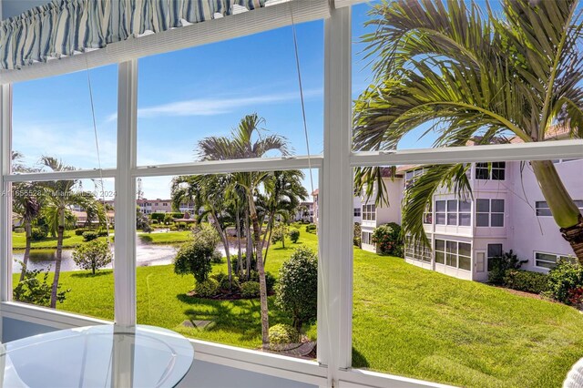 3501 NW 47th Ave Unit 516, Lauderdale Lakes, FL 33319 - unfurnished sunroom featuring a water view