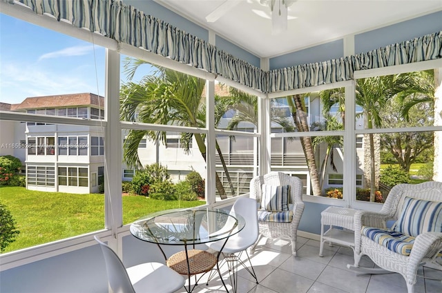 sunroom with plenty of natural light and ceiling fan