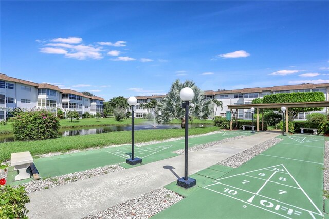 3501 NW 47th Ave Unit 516, Lauderdale Lakes, FL 33319 - surrounding community with shuffleboard, a water view, and a residential view