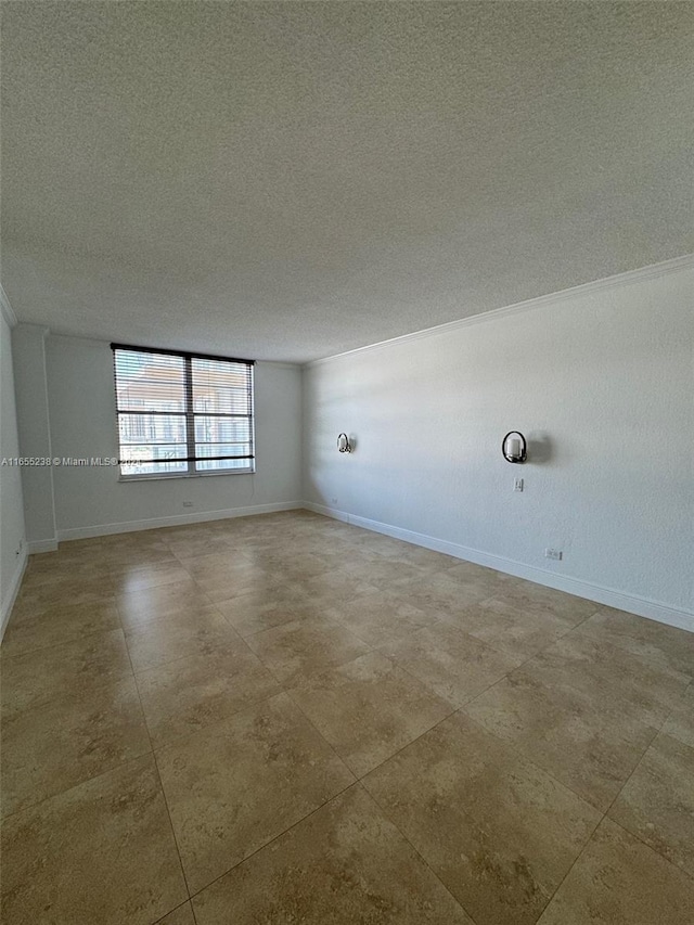 empty room featuring a textured ceiling