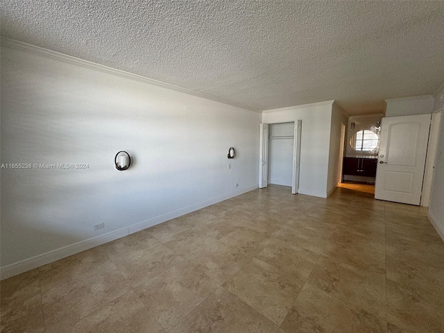 interior space featuring crown molding and a textured ceiling