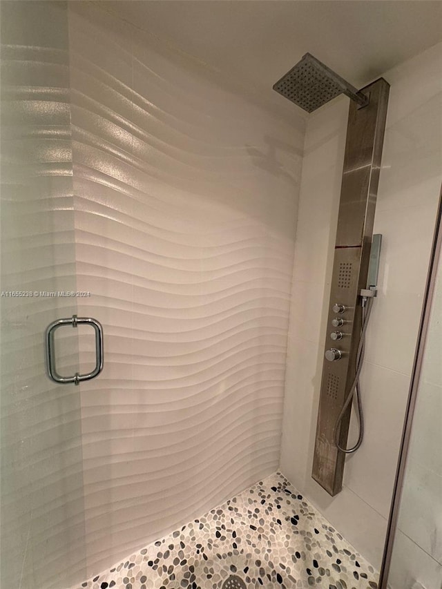 bathroom featuring an enclosed shower