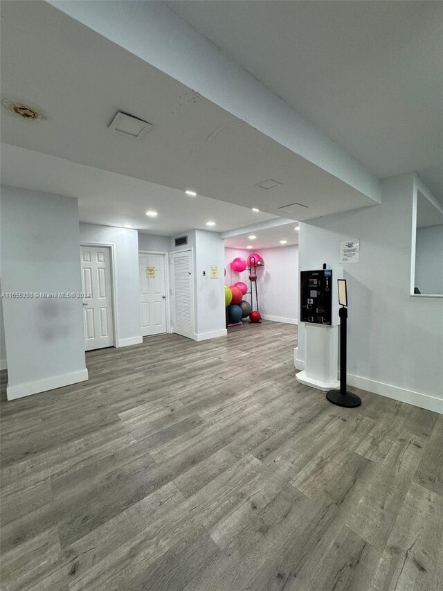 basement featuring hardwood / wood-style floors