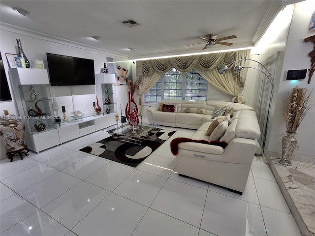 tiled living room with crown molding and ceiling fan