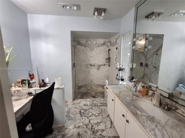 bathroom with vanity and a shower with door