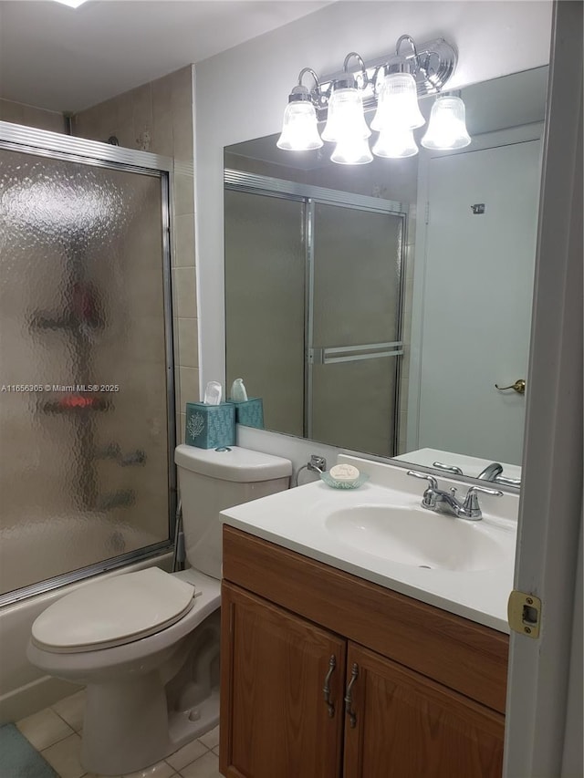 full bathroom featuring enclosed tub / shower combo, tile patterned floors, vanity, and toilet