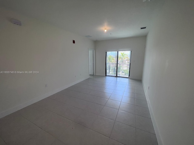 spare room with light tile patterned floors