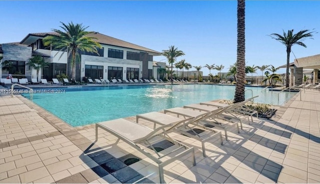 view of swimming pool with a patio area