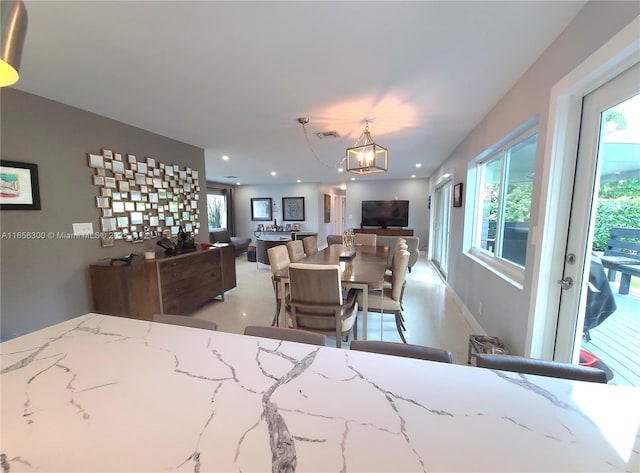 dining space with a chandelier