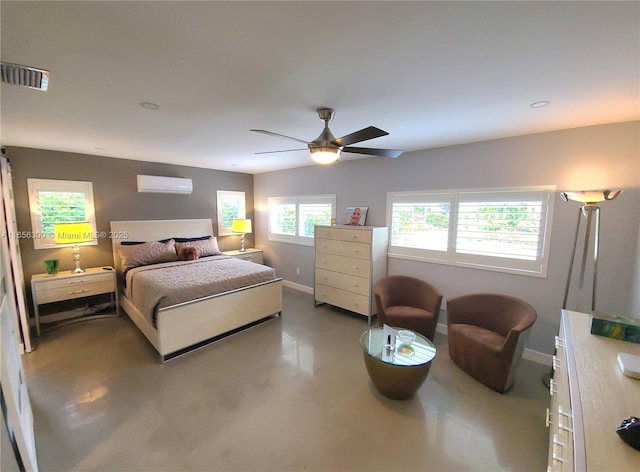 bedroom featuring a wall unit AC and ceiling fan