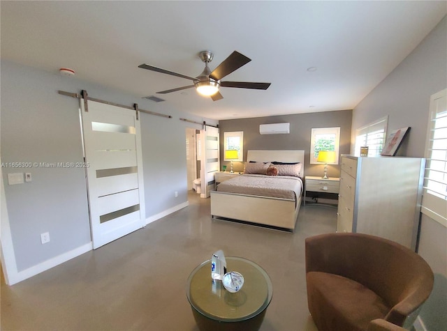 bedroom featuring concrete floors, a wall unit AC, a barn door, and ceiling fan