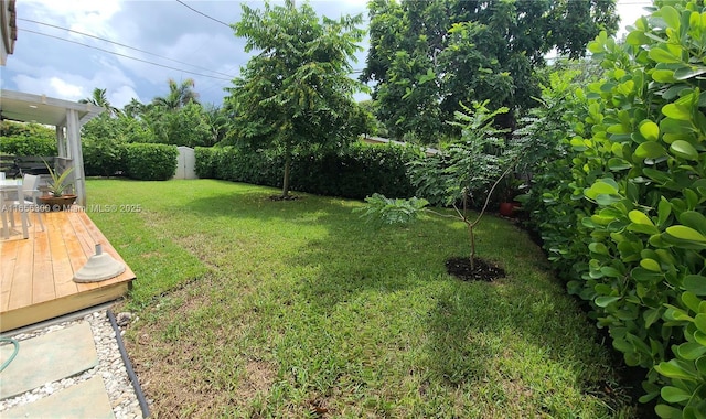 view of yard with a deck