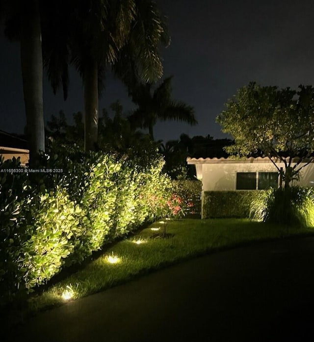 view of yard at twilight