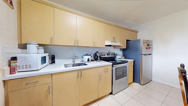 kitchen with sink, light brown cabinets, appliances with stainless steel finishes, and light tile patterned flooring