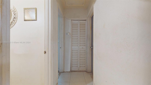 hallway featuring light tile patterned floors