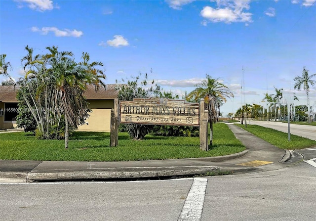 community sign with a lawn