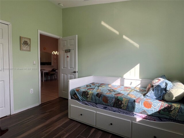 bedroom featuring dark hardwood / wood-style flooring