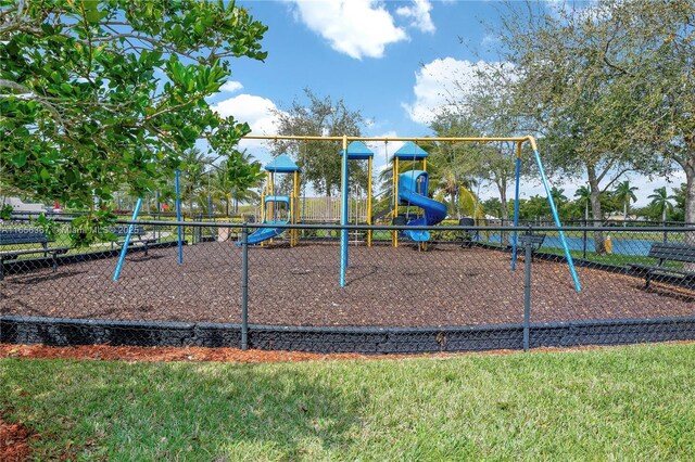 view of playground with a lawn