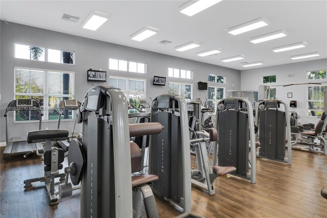 gym featuring dark wood-type flooring