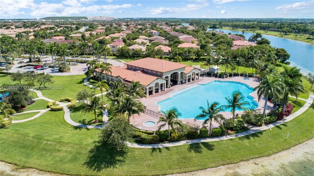 birds eye view of property with a water view