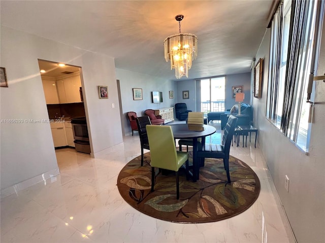 dining space featuring an inviting chandelier