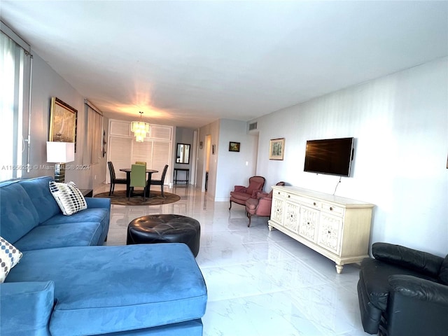 living room with a notable chandelier