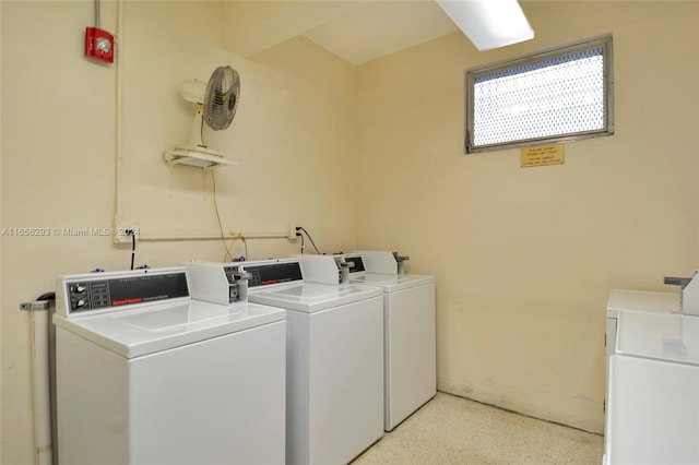 clothes washing area with washer and dryer