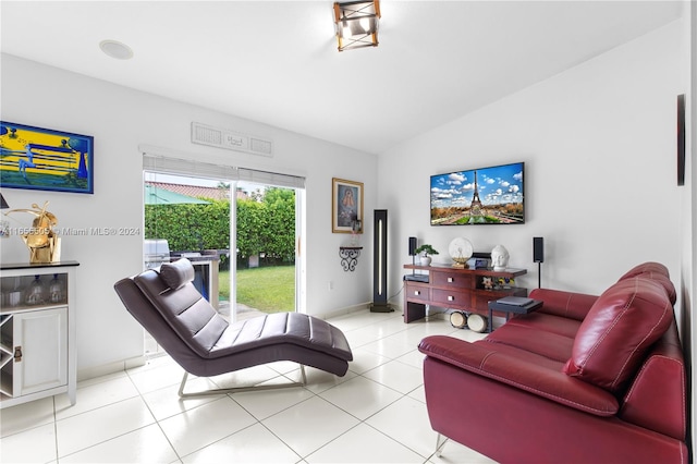 tiled living room featuring lofted ceiling