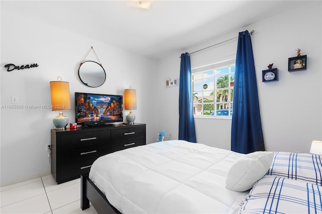 bedroom with light tile patterned floors