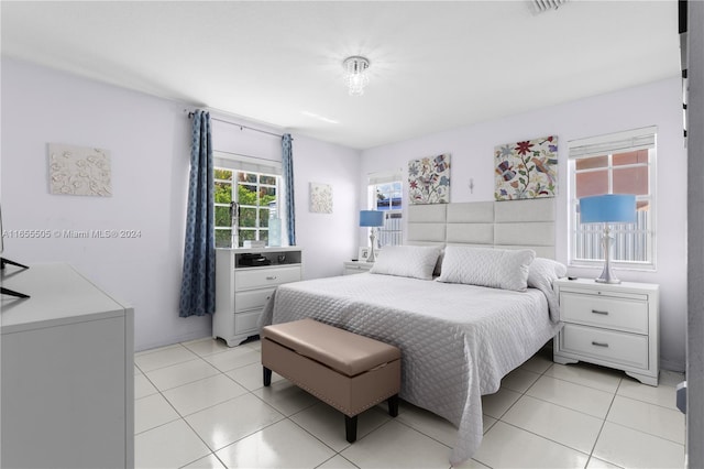 bedroom with light tile patterned floors