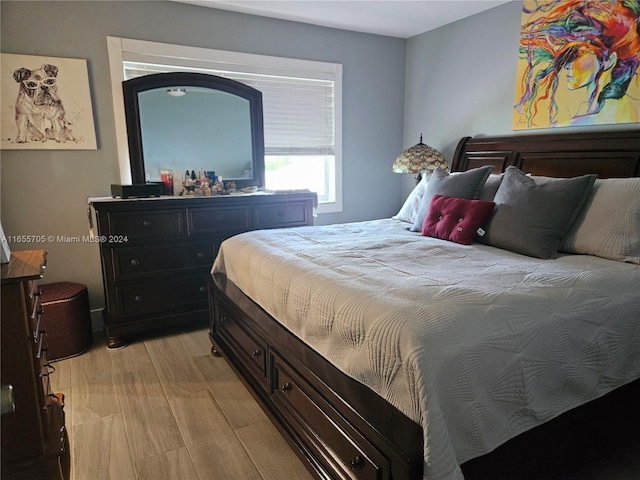 bedroom with light hardwood / wood-style flooring