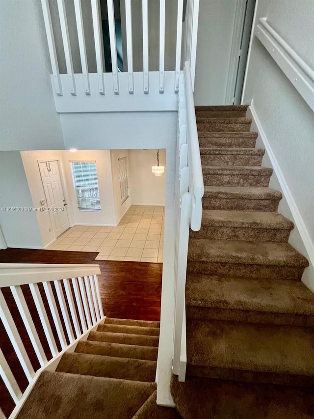 staircase featuring hardwood / wood-style flooring