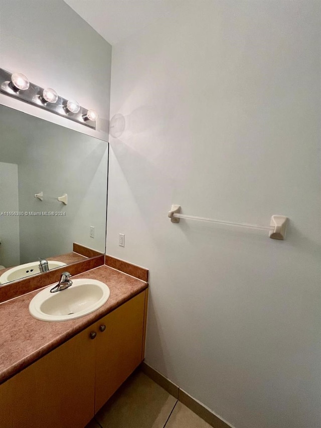 bathroom with tile patterned floors and vanity