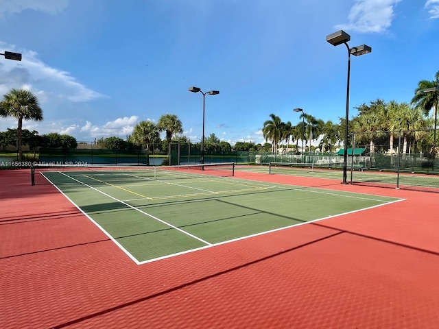 view of tennis court featuring basketball court