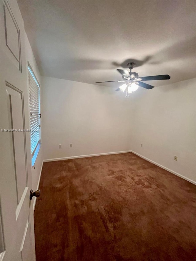 carpeted empty room with ceiling fan