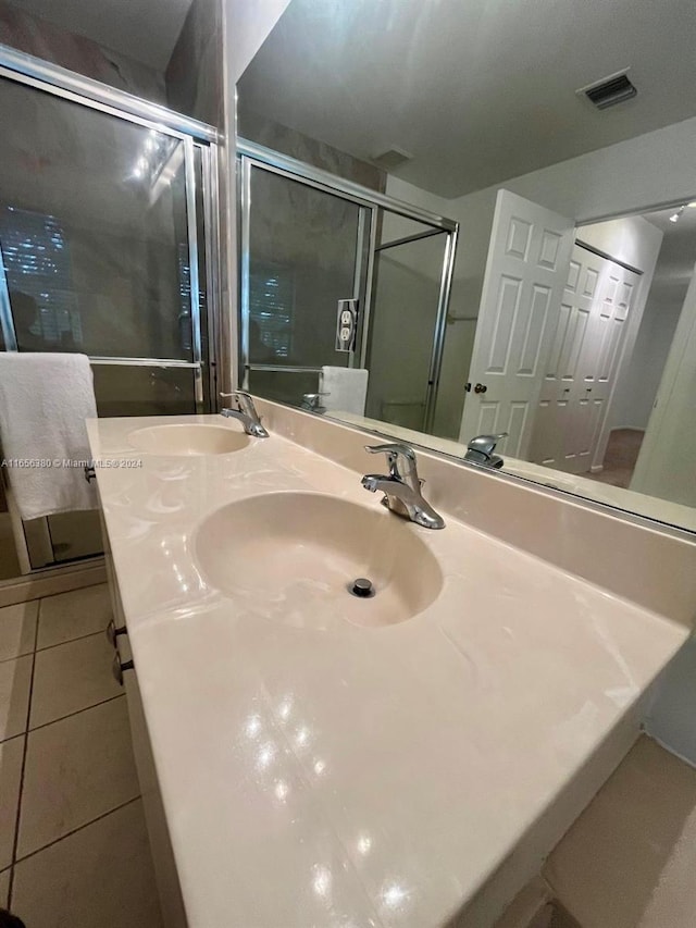 bathroom featuring tile patterned floors and vanity