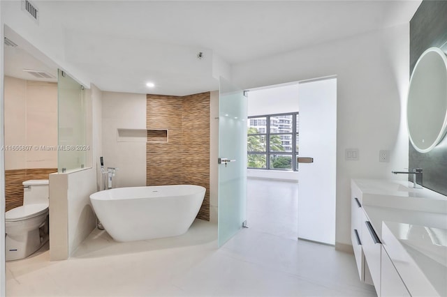 full bathroom featuring vanity, tile walls, toilet, and separate shower and tub