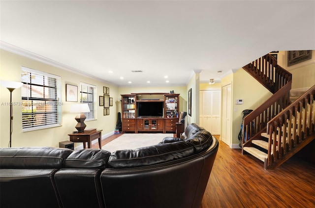 living room featuring ornamental molding and dark hardwood / wood-style flooring