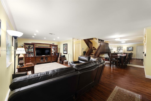 living room with crown molding and dark hardwood / wood-style floors