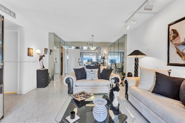 tiled living room with a textured ceiling