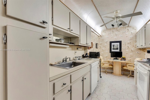 kitchen with sink, white cabinets, white appliances, and light tile patterned floors