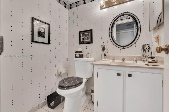 bathroom featuring vanity, toilet, and tile patterned flooring