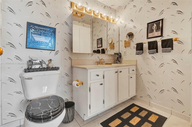 bathroom featuring vanity, toilet, and tile patterned flooring