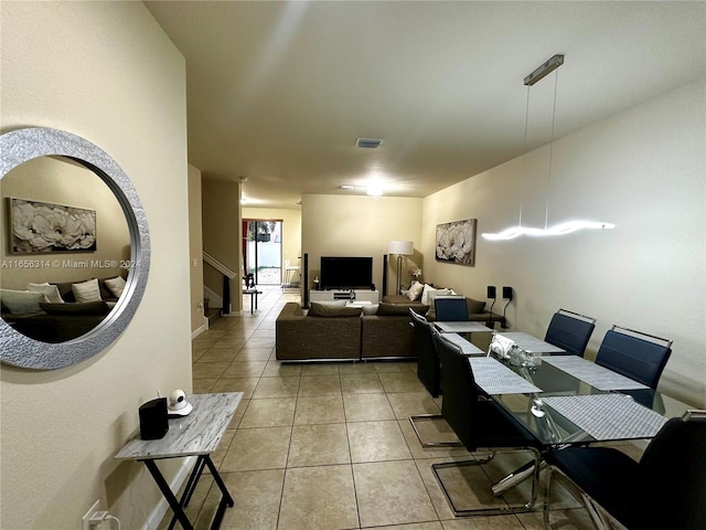 dining space featuring tile patterned flooring