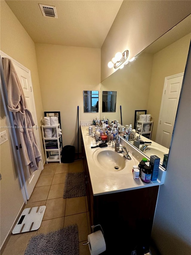 bathroom with tile patterned flooring and vanity