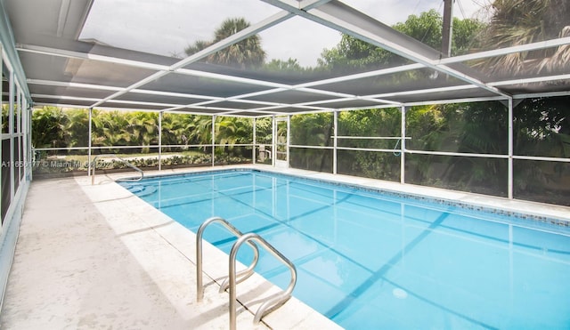 view of pool featuring a lanai and a patio area