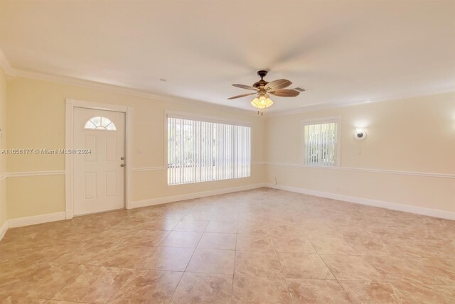 interior space featuring crown molding and ceiling fan