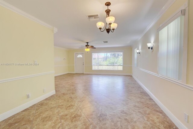 empty room with ornamental molding and ceiling fan with notable chandelier